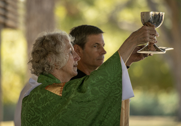 The Reverend Mary Ann Huston, assisted by John Haynes at right, conducts a Blessing of the Animals service for Grace Episcopal Church at San Gabriel Park on Sunday, October 6, 2024.   Photo by Andy Sharp.