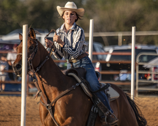 Jaycee Ferguson competes in Senior Polebending  at the 31st Annual Clayman Rodeo on Saturday, October 5, 2024.  Held at Windsong Farm, the rodeo was founded by Kelly and Jim Bob Clayman.    Photo by Andy Sharp.