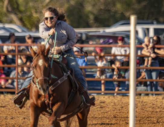 Aaren Horak-Lehmberg heads for a strong finish in Senior Polebending at the 31st Annual Clayman Rodeo on Saturday, October 5, 2024.  Held at Windsong Farm, the rodeo was founded by Kelly and Jim Bob Clayman.    Photo by Andy Sharp.