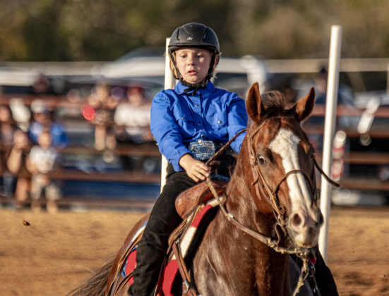 Claire Smith competes in Senior Polebending  at the 31st Annual Clayman Rodeo on Saturday, October 5, 2024.  Held at Windsong Farm, the rodeo was founded by Kelly and Jim Bob Clayman.    Photo by Andy Sharp.
