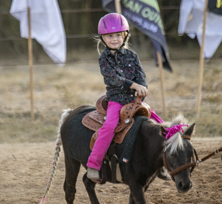 4-year-old Raynee Wing wasn't competing, but enjoyed a brief ride around the arena on a tiny horse  at the 31st Annual Clayman Rodeo on Saturday, October 5, 2024.  Held at Windsong Farm, the rodeo was founded by Kelly and Jim Bob Clayman.    Photo by Andy Sharp.