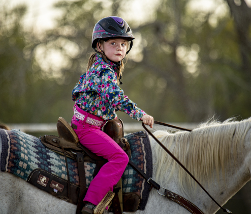 6-year-old Ryleigh Wing puts on her game face as she gets ready to compete in Junior Barrel Racing at the 31st Annual Clayman Rodeo on Saturday, October 5, 2024.  Held at Windsong Farm, the rodeo was founded by Kelly and Jim Bob Clayman.    Photo by Andy Sharp.