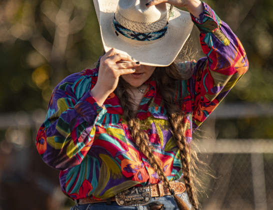 Caroline Heard readjusts her hat after it flew off during Senior Polebending at the 31st Annual Clayman Rodeo on Saturday, October 5, 2024.  Held at Windsong Farm, the rodeo was founded by Kelly and Jim Bob Clayman.    Photo by Andy Sharp.