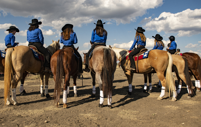 The Clayman Cowgirls get ready to enter the rodeo arena  at the 31st Annual Clayman Rodeo on Saturday, October 5, 2024.  Held at Windsong Farm, the rodeo was founded by Kelly and Jim Bob Clayman.    Photo by Andy Sharp.