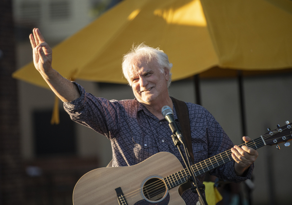Ken Covington acknowledges the crowds' applause after performing with Bob Case during a First Friday Concert held at Founders Park on Friday, October 4, 2024.  Covington, founder of Kenz Guitars,  suffered a stroke in September 2023.  He's been on the mend for the past year.  He was honored with a proclamation presented by Georgetown Mayor Josh Schroeder.   Photo by Andy Sharp. 