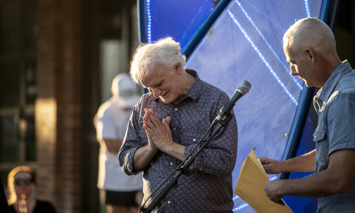Ken Covington , left, stands with Georgetown Mayor Josh Schroeder  during a First Friday Concert held at Founders Park on Friday, October 4, 2024.  Covington, founder of Kenz Guitars,  suffered a stroke in September 2023.  He's been on the mend for the past year.  He was honored with a proclamation presented by  Schroeder.   Photo by Andy Sharp.