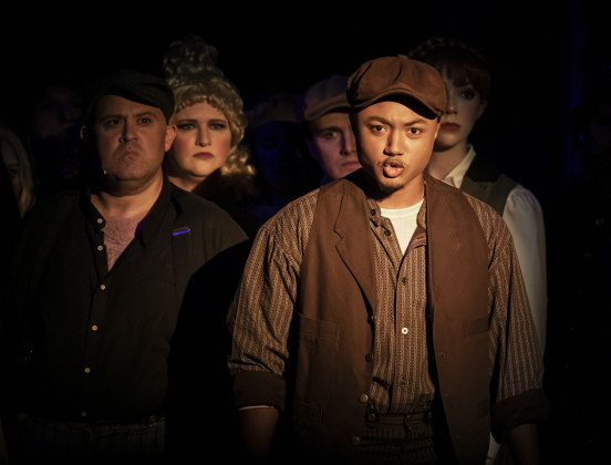 Ensemble cast member Theron Howard (front) joins other cast members in a scene during a Thursday, October 3, 2024 dress rehearsal of "Sweeney Todd," playing on the Springer Stage at the Georgetown Palace through November 3rd.    Photo by Andy Sharp.