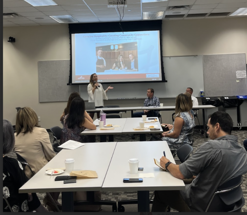 Rachel Cummins, owner of Sweet Lemon Kitchen, presents at the Chamber of Commerce meeting Breakfast Bites & Downtown Lowdown