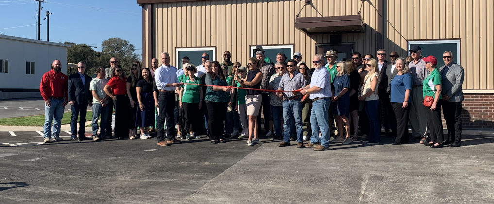 Representatives from the City of Georgetown, Texas Disposal Services, Novak Commercial Construction and Sun City Recycles Club gather together to cut the ribbon on the new Transfer Station. (Photo by Kaitlyn Wilkes