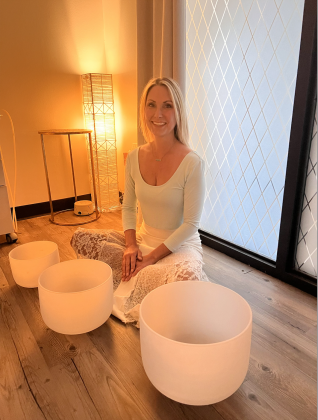Jessica Francis sitting in front of her sound bowls.
