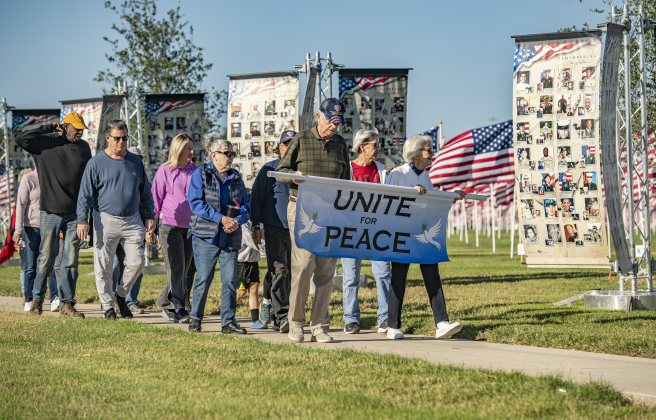 A Peace Walk coordinated by the Rotary Club of Georgetown Racial Unity and Peace Committee was held around the perimeter of the flags  on Saturday, November 9, 2024, the official opening day of the Field of Honor.   Sponsored by the Rotary Club of Georgetown, the Field of Honor includes 2,000 American flags covering ten acres in San Gabriel Park.  With events throughout the week, the flags will fly here until November 17th.   Photo by Andy Sharp.