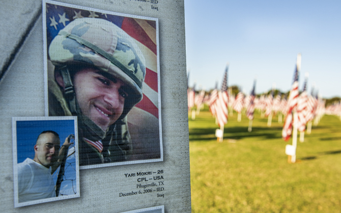 One of 5,394 photos on display,  coordinated by "Remembering Our Fallen" was Yari Mokri of Pflugerville, who was killed at age 26  in a 2006  IED attack in Iraq,  is seen  on Saturday, November 9, 2024, the official opening day of the Field of Honor.   Sponsored by the Rotary Club of Georgetown, the Field of Honor includes 2,000 American flags covering ten acres in San Gabriel Park.  With events throughout the week, the flags will fly here until November 17th.   Photo by Andy Sharp.