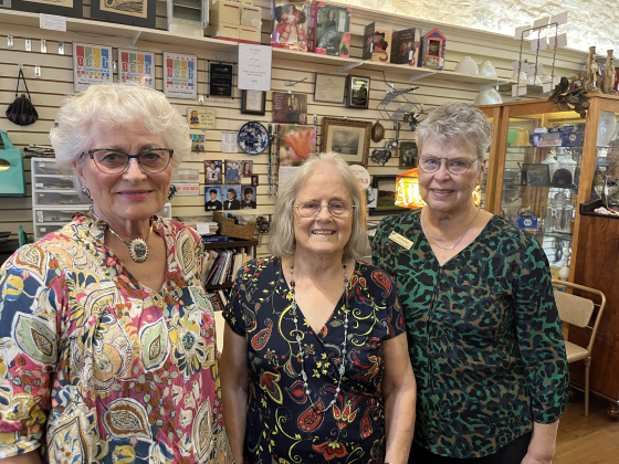 Georgetown Antique Mall Owner Carolyn Martin (middle), stands with her store associates, Barbara Burkhalter (left) and Jan Kendall. Photo by Abbey Archer