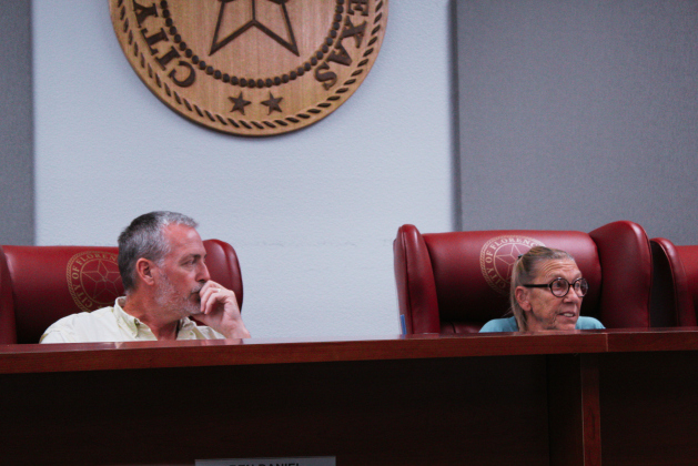 Mayor of Florence Ben Daniel, left, and Mayor ProTem Mary Condon, right, listen to the monthly department reports during the November 12 City Council meeting. Photo by Nalani Nuylan.