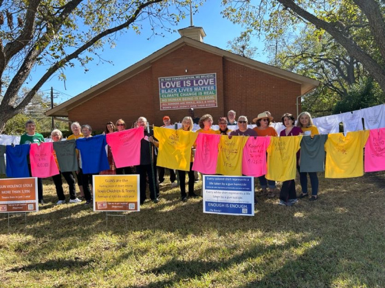  Members of the San Gabriel Unitarian Universalist Fellowship pose with the Vidas Robadas, or Stolen Lives, installation. Photo courtesy the San Gabriel Unitarian Universalist Fellowship.