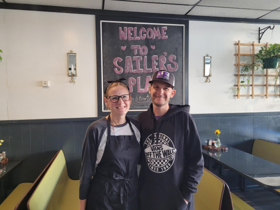 Alesha Lancaster and her husband Chad own Sailer’s Place, a new restaurant in Florence. The restaurant is named after their 6-year-old daughter, Sailer. Some of her art can be seen in chalk on the welcome sign in the background. Photo by Nalani Nuylan. 
