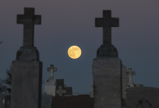  A full moon, also called a Beaver Moon, rises over Granger's Holy Cross Cemetery on Friday, November 15, 2024.   Photo by Andy Sharp. 
