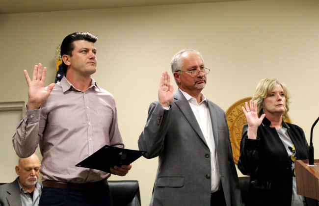 Mayor Patrick Sherek, left, Alderman Place 1 Daniel Klepac, center, and Place 2 Alderwoman Lori Allen take their oaths to serve November 19. 