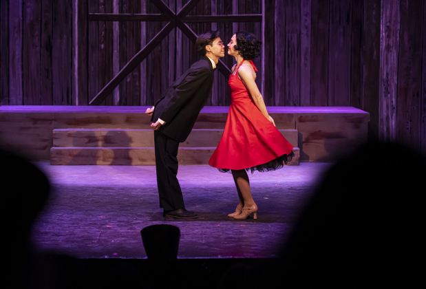 Nathan Tran, left, playing Phil Davis, and Alicia Frias, as Judy Haynes, are pictured in the Georgetown Palace dress rehearsal for "White Christmas" on Thursday, November 21, 2024.  The production is playing on the Springer Stage through December 29th.  Photo by Andy Sharp.