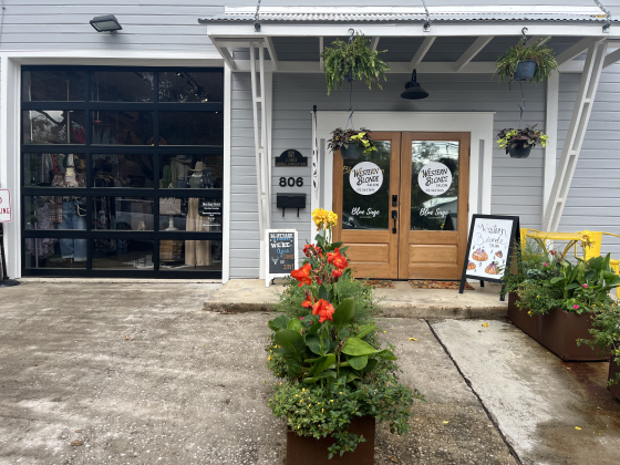 Street view of Western Blonde Salon and the garage door that opens into Blue Sage Clothiers at 806 South Myrtle Street