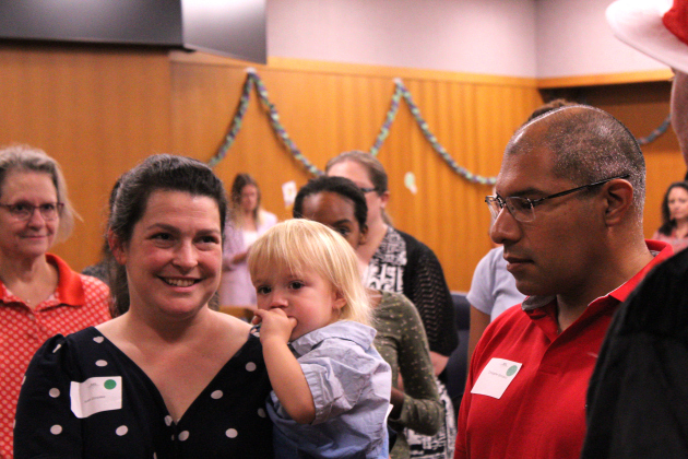 Susan Gonzalez, left, with her husband Christopher, right, adopt one-year-old Luke, center, on Adoption Day.