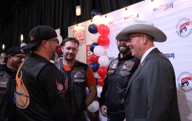 Matt Lindemann, right, speaks with a biker group at the Wilco Republican Watch Party on November 5. Photo by Nalani Nuylan.