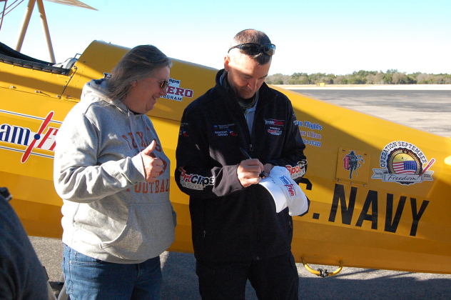 After her flight, Army veteran Emily Johnson waits for a Dream Flights hat signed by pilot Hunter Stuckey. (Photo by Kaitlyn Wilkes)