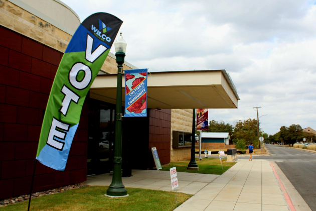 Registered Williamson County voters line up to cast their ballot at the polling location in Georgetown City Hall.  Photo by Nalani Nuylan.