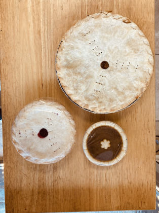 Pie Jacked in Round Rock offers vegan top-allergy free pies in three sizes. Displayed are a 9-inch family-sized apple pie, a 5.5-inch sweetie-sized cherry pie and a 4-inch cutie-size pumpkin pie. 