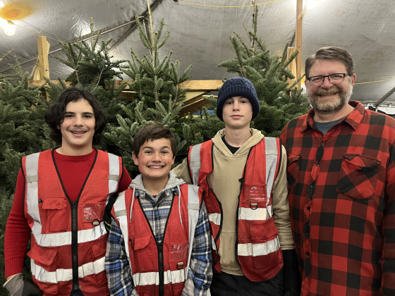 From left, Boy Scout Troop 155 Tree Leader Adam Jalbert stands in front of trees at the lot on Williams Drive with fellow scouts Gryphin Adams and Noah Dance and Scoutmaster Nathan Fontenot. 