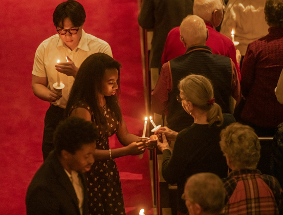 Candles are lighted at Lois Perkins Chapel, the site of two candlelight services at Southwestern University,  on Thursday, December 5, 2024. The annual Service of Lessons and Carols began in 1915, then called the Christmas Carol Service.   Photo by Andy Sharp.