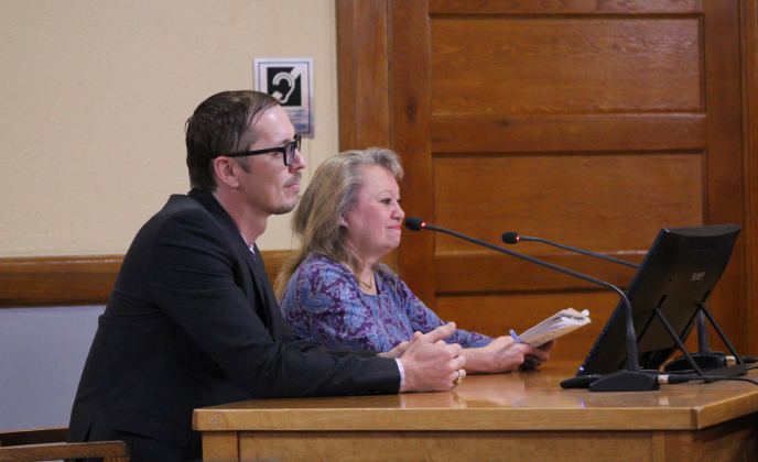 Granger City Mayor Monica Stojanik, back, and Granger ISD Superintendent Stephen Brosch, front, share the current needs of the Granger area during the December 10 Commissioners Court meeting. Photo by Nalani Nuylan.