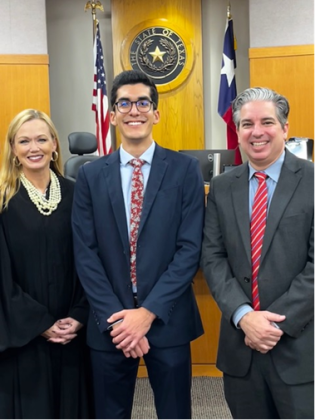 Judge Sarah Bruchmiller of the 368th District Court (left), administered the oath of office to Christopher Alvarado (center), who was a Williamson County District Attorney’s Office intern. He is joined by District Attorney Shawn Dick, right.  Photo courtesy of the Williamson County District Attorney’s Office.