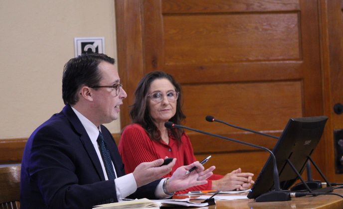 Williamson County Director of Communications Connie Odom and Ryan Murray from ETC Institute present findings of the county's first community-wide survey during the December 17 Commissioners Court meeting. Photo by Nalani Nuylan.