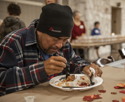 Edgar Ramirez enjoys his meal during the Community Thanksgiving, held Thursday, November 28, 2024.