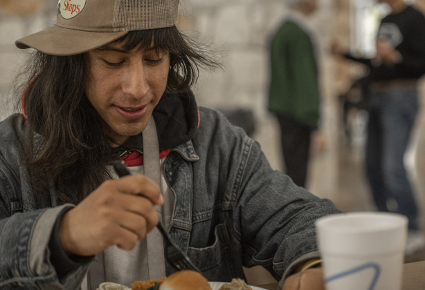 Felipe Nuñez  enjoys a meal during the Community Thanksgiving.