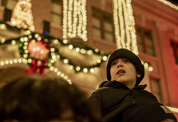 7-year-old Landon Knippel is enchanted by the lights during the annual Lighting of the Square in downtown Georgetown on  Friday, November 29, 2024. The streets and courthouse lawn were jammed with thousands of attendees on a cool autumn evening.    Photo by Andy Sharp.
