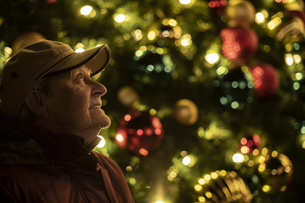Betty Manross, 79, takes time to enjoy the lights of the square's Christmas tree during the annual Lighting of the Square in downtown Georgetown on  Friday, November 29, 2024. The streets and courthouse lawn were jammed with thousands of attendees on a cool autumn evening.    Photo by Andy Sharp.