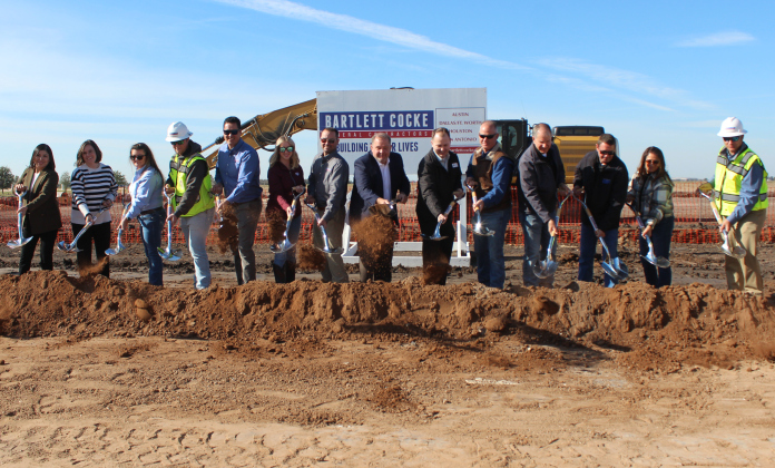From left to right: Karla Murillo, Jamie Zavodny, Denise Register, Andrew Larsen, Marc Hibner, Madison Seale, Sean Stevens, Precinct 4 Commissioner Russ Boles, Jeffery Jenkins, Nathan Lerow, Russell Fishbeck, Jason Brown, Kelley Hernandez-Host, and Gabe Rodriguez break ground on the West Arena, Monday, December 2. Photo courtesy of Williamson County.