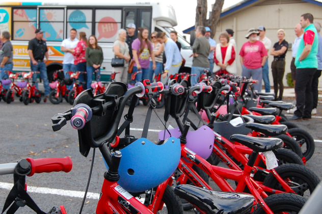 The bikes given to the children were accompanied by colorful helmets and sparkly stickers so the children could put their names on their helmets or bikes. (Photos by Kaitlyn Wilkes)