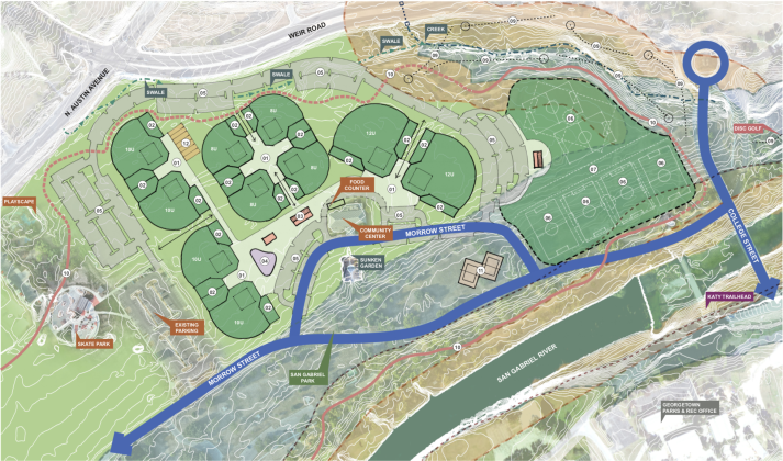 In this plan, the parking lot surrounds the playing fields, making the fields more insular in the park.