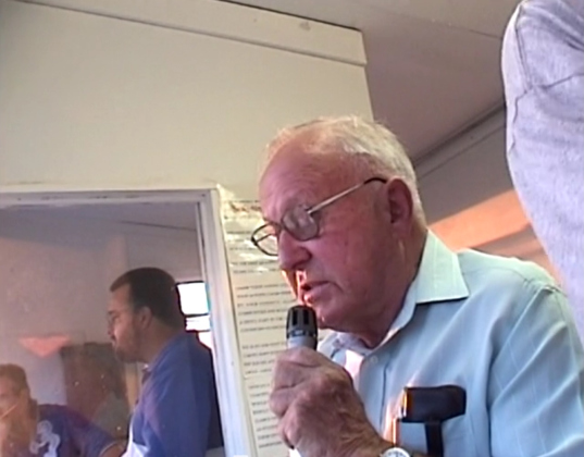Marcus Lindemann announces a football game in the Bartlett press box from Director Ray Seggern’s footage that he shot in 2000. Photo courtesy of "Voice of the Bulldogs."