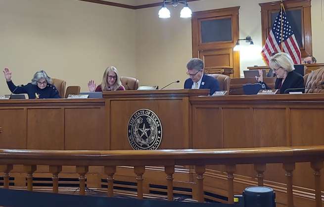 Williamson County Commissioners Terry Cook, Cynthia Long, County Judge Bill Gravell and Valerie Covey approve the funding for the construction improvements for RM 2243. Photo by Nalani Nuylan.