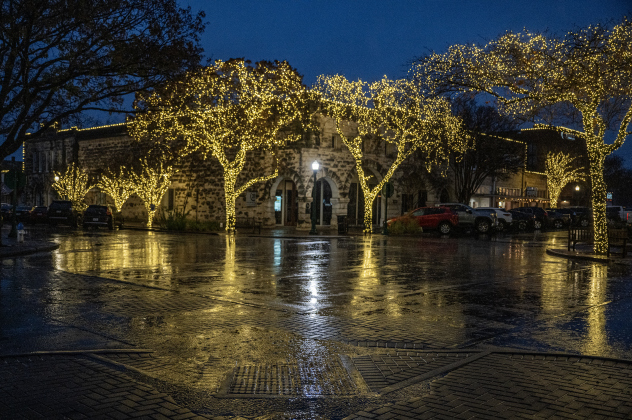 Eighth and Main Streets in downtown Georgetown were soaked, allowing reflections of holiday lights still in place on a cold, wet and misty  Thursday, January 9, 2025.   Photo by Andy Sharp.