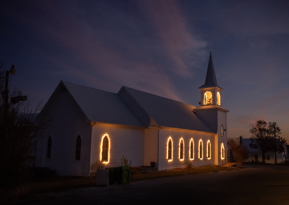 Saint Peter’s Church of Coupland is adorned with holiday lights   on Friday, December 27, 2024.   Photo by Andy Sharp. 