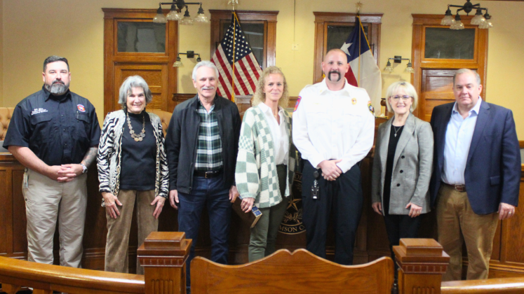 Mike Lugo, center, was sworn in as Williamson County’s new Fire Marshal, January 28. Commemorations of him are Bill Zito, director of Emergency Services (far left), County Commissioner Terry Cook, Mr. Lugo’s family, County Commissioner Valerie Covey and County Commissioner Russ Boles, far left. Photo by courtesy of Williamson County.