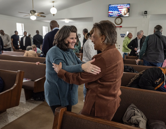 Georgianne Hewett, left, spends time with Rae Gill before the service at Macedonia Baptist Church.