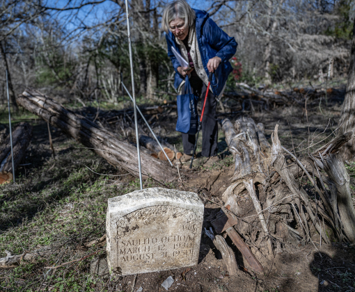 Peggy Bailey, a Sun City resident and member of the Williamson County Cemetery Restoration Volunteers, inspects gravesites in an unnamed cemetery adjacent the Lawrence Chapel Cemetery on Saturday, January 18, 2025.