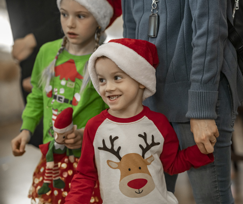 Filip, 4, front, and his sister Amelia, 6, were excited as they waited to see Santa Claus during Breakfast With Santa, held Saturday, December 21, 2024 at the San Gabriel Community Center.  (Editors: mom declined to provide a last name, but is okay with first names only).  The event, coordinated by the Georgetown Fire Department and the Rotary Club of Sun City, served up pancakes, sausage, juice and coffee too attendees.  Santa Claus was there throughout the morning to visit the kids and their families.