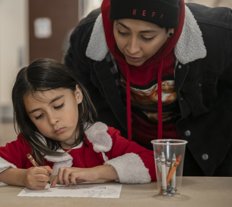Mom Heather Gutierrez helps daughter Isabelle, 6,  write a Letter to Santa  during Breakfast With Santa, held Saturday, December 21, 2024 at the San Gabriel Community Center.  The event, coordinated by the Georgetown Fire Department and the Rotary Club of Sun City, served up pancakes, sausage, juice and coffee too attendees.  Santa Claus was there throughout the morning to visit the kids and their families.    Photo by Andy Sharp.
